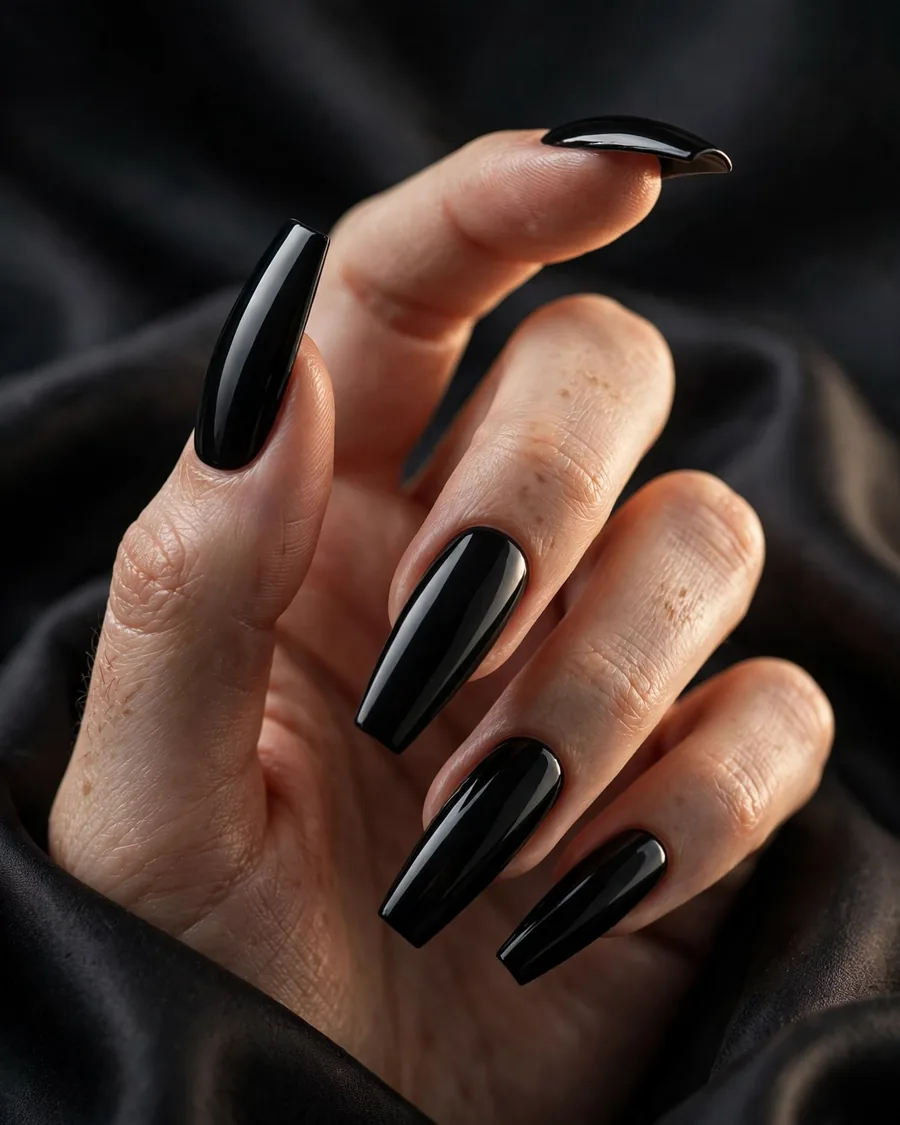 High-gloss jet-black coffin nails with mirror shine