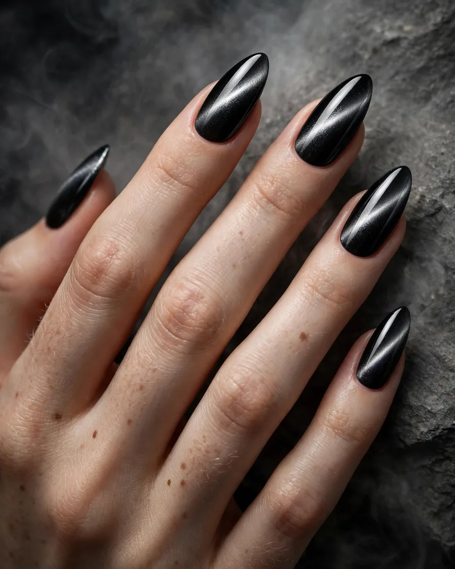 Black cat-eye magnetic nails with silver diagonal shimmer